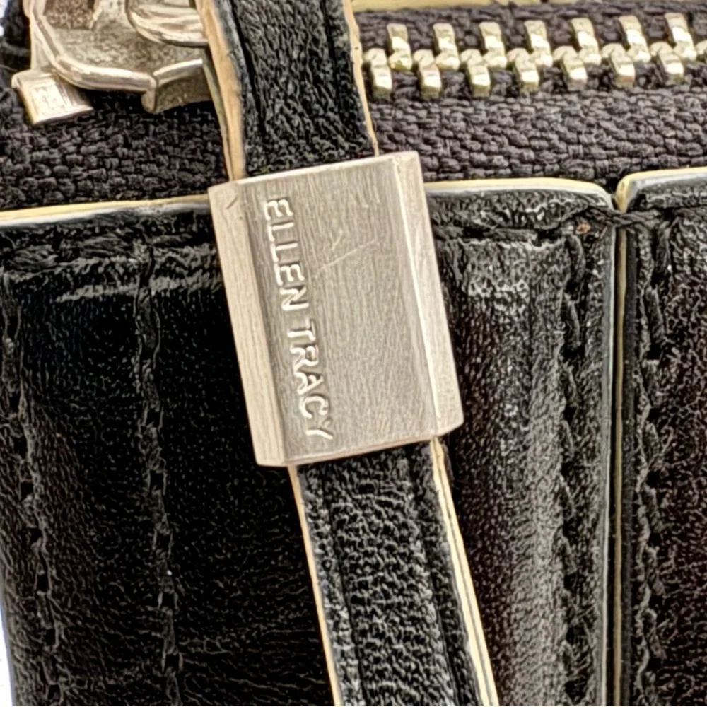 Ellen Tracy Black Leather Clutch with red logo interior.